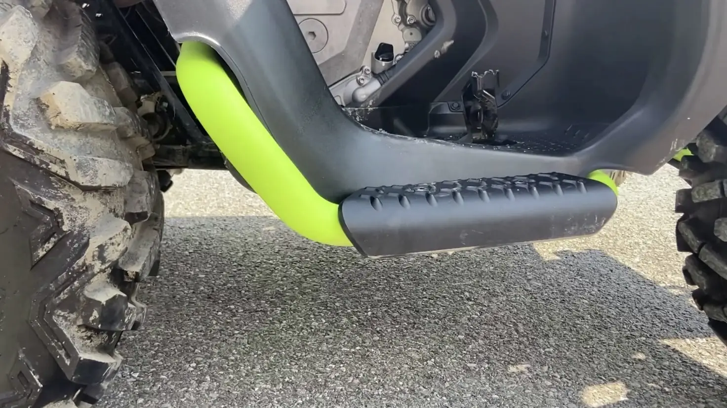 Green tubular protection and footboard of a Segway ATV Snarler AT6 side view.